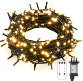Coiled string lights with control panel and plug on a white background